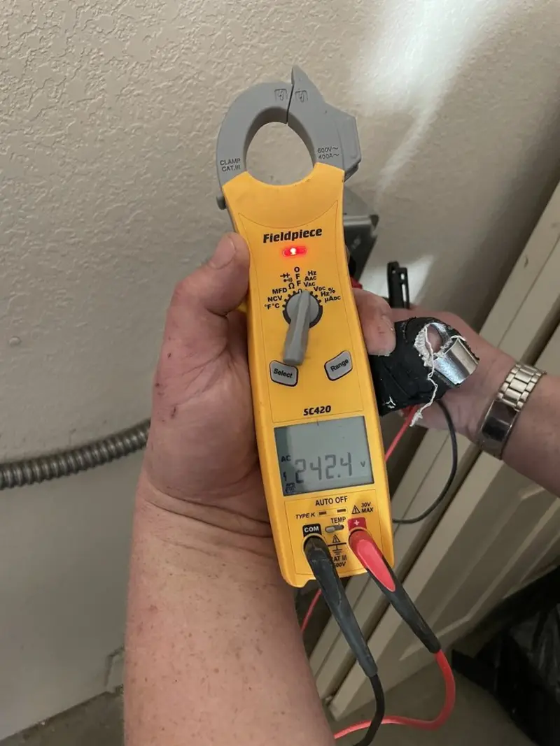 Voltage testing with clamp meter during Circuit Breaker Repair in Raytown